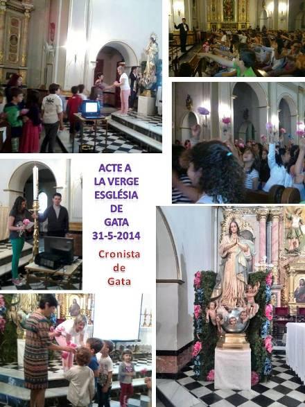 ELS XIQUETS I XIQUETES FAN UN ACTE MARIÀ A L'ESGLÉSIA